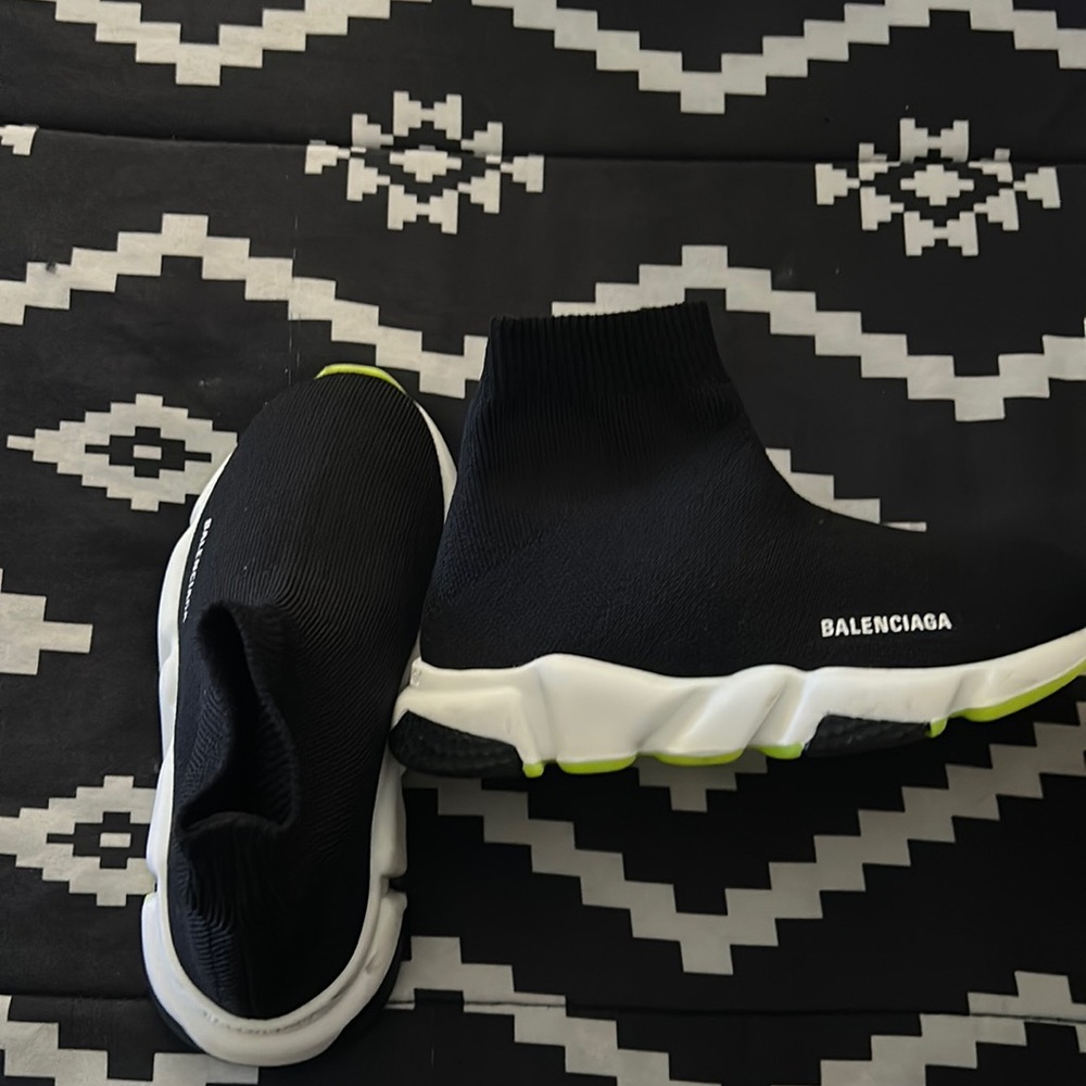 Black and green Balenciaga kid speed trainers.